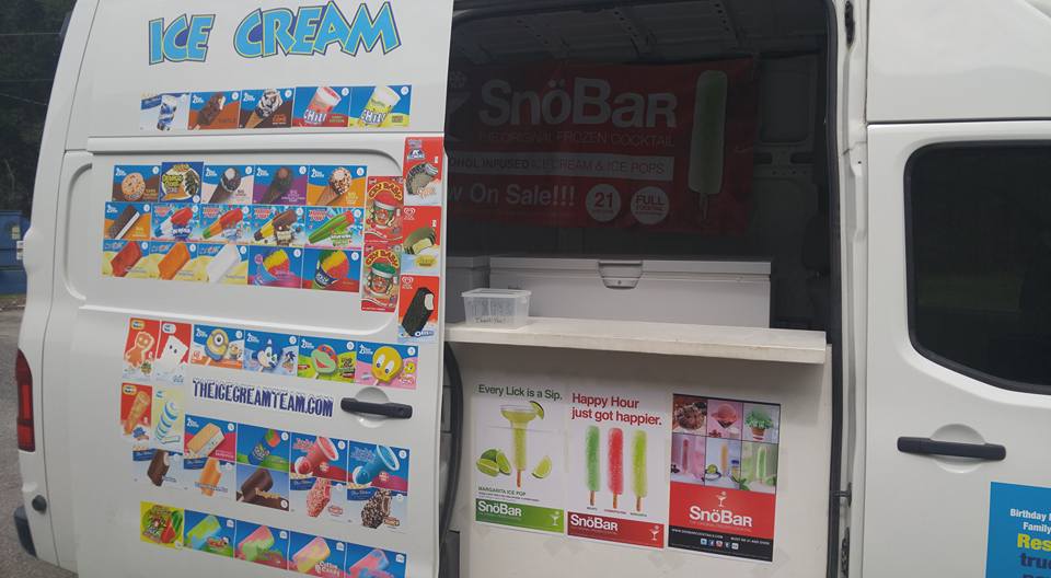 Our white ice cream truck with the serving hatch open